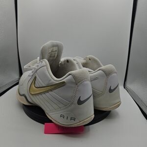 Nike White Sneakers with Gold Swoosh